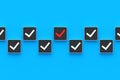 False changing. Red check mark on button. Incorrect choice concept. Wrong decision. Negative action. Falsification of results
