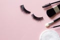 False eyelashes and cosmetic tools for eye makeup on pink background, concept Royalty Free Stock Photo