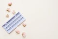 False eyelashes in pack on white background with little light pink roses with a copy space Royalty Free Stock Photo