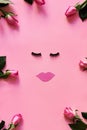 False eyelashes and paper lips on pink background