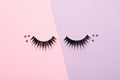 False eyelashes and sparkles on color background Royalty Free Stock Photo