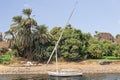 Faluca boat moored in Nile river at Aswan, Egypt Royalty Free Stock Photo