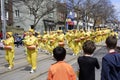 Falun Dafa marching group dressed in traditional Chinese costume play waist drum during the Beaches Easter Parade 2017 on Queen St