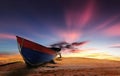 Faluwa boat during sunset with moving clouds