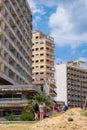 People gaze at the abandoned hotels by the beach of the ghost city of Varosha Famagusta on a sunny day