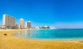 FAMAGUSTA, CYPRUS, AUGUST 29, 2017: People are enjoying a sunny day on a beach in front of Varosia district of Famagusta, Cyprus