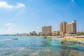 FAMAGUSTA, CYPRUS, AUGUST 29, 2017: People are enjoying a sunny day on a beach in front of Varosia district of Famagusta, Cyprus