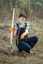 Famale farmer planting sprouts Royalty Free Stock Photo