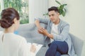 Famale psychiatrist listening to her patient who experienced traumatic events Royalty Free Stock Photo