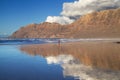 Famara Cliffs Reflected on Famara Beach Royalty Free Stock Photo