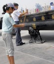 Famen Temple, Shaanxi Province, China: Worshipers burning incense in front of the Namaste Dagoba.