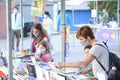 Families browsing books, touring the Felba, a book fair in Buenos Aires