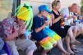 Families enjoy a shave ice treat