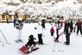 Families on holiday on the slopes of the Italian Alps. Royalty Free Stock Photo