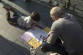 Families with kids playing on an art installation outside the Royal Festival Hall in South bank