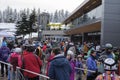 Skiers and snowboarders stand in line for lift tickets at Whistler Village