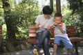 mom and kid playing smartphone Royalty Free Stock Photo