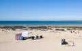 Families relaxing in the sun on Rhosneigr Beach