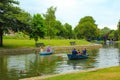 Families ride boats Royal Military Canal Hythe England