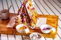 Familiy building a sweet ginger bread house