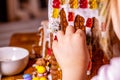 Familiy building a sweet ginger bread house