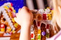 Familiy building a sweet ginger bread house