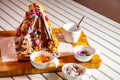 Familiy building a sweet ginger bread house