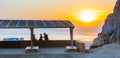 Family admiring a beautiful sunrise on the dead sea