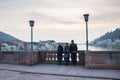 Family admiring the view from old bridge of Heidelberg
