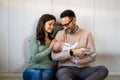 Family, adoption, baby, parenthood and people concept. Happy mother father with newborn baby at home Royalty Free Stock Photo