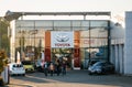 Family adults senior exiting toyota car showroom