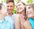 Family afternoon in the park. Happy family smiling while outdoors. Royalty Free Stock Photo