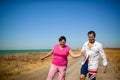 Family, age and people concept - happy senior couple holding hands talking outdoors Royalty Free Stock Photo