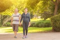 Family, age, sport, healthy and people concept - happy senior couple holding hands and exercising together. Royalty Free Stock Photo