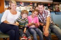 Family In Airport Departure Lounge Waiting To Go On Vacation Royalty Free Stock Photo