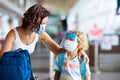 Family in airport in face mask. Virus outbreak Royalty Free Stock Photo