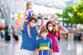 Family in airport in face mask. Virus outbreak