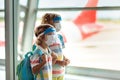 Family in airport in face mask. Virus outbreak Royalty Free Stock Photo