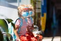 Family in airport in face mask. Virus outbreak Royalty Free Stock Photo