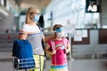 Family in airport in face mask. Virus outbreak Royalty Free Stock Photo