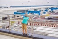 Family at airport before flight. Boy waiting to board at departure gate of modern international terminal. Traveling and Royalty Free Stock Photo