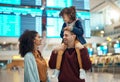 Family, airport and travel with a girl child sitting on the shoulders of her father in a terminal for a holiday flight Royalty Free Stock Photo