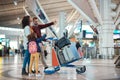 Family at airport, travel and vacation with luggage, mother and father with child, ready for flight and adventure Royalty Free Stock Photo