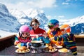 Family apres ski lunch in mountains. Skiing fun Royalty Free Stock Photo