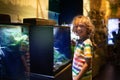 Family in aquarium. Kids watch fish, marine life Royalty Free Stock Photo