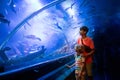 Family in aquarium. Kids watch fish, marine life Royalty Free Stock Photo