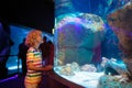 Family in aquarium. Kids watch fish, marine life Royalty Free Stock Photo