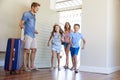 Family Arriving At Summer Vacation Rental Royalty Free Stock Photo