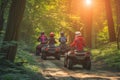 family on atvs following a forest trail together