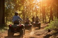 family on atvs following a forest trail together Royalty Free Stock Photo